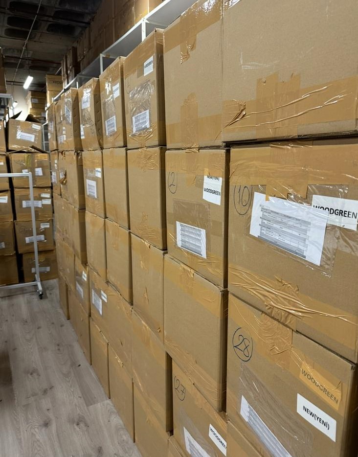 Warehouse aisle with bulk inventory stored in labelled cartons